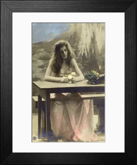 Framed Print : South African Beauty - seated at a table pondering a flower Framed Print : South African Beauty - seated at a table pondering a flower