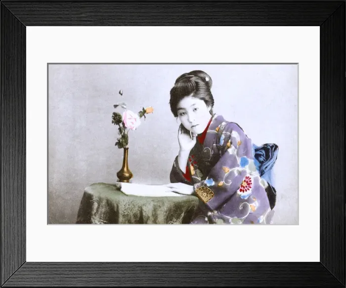 Framed Print : Japan - Geisha Girl - reading a book at a small table Framed Print : Japan - Geisha Girl - reading a book at a small table