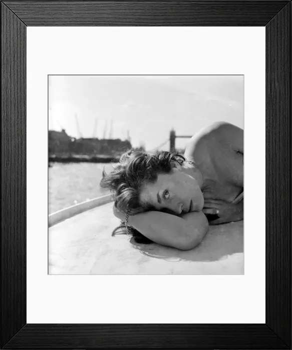 Framed Print : Young woman modelling on a boat