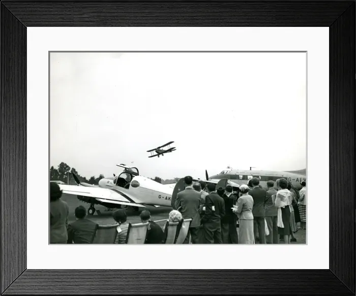 Framed Print : A de Havilland Moth flies past the de Havilland Dove, G-?