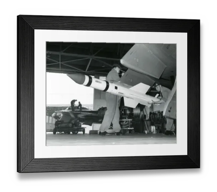 Framed Print : A de Havilland Firestreak air-to-air missile being loade? Framed Print : A de Havilland Firestreak air-to-air missile being loade?
