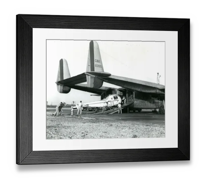 Framed Print : A Bell Model 47J being loaded into a Fairchild C-82 of t? Framed Print : A Bell Model 47J being loaded into a Fairchild C-82 of t?