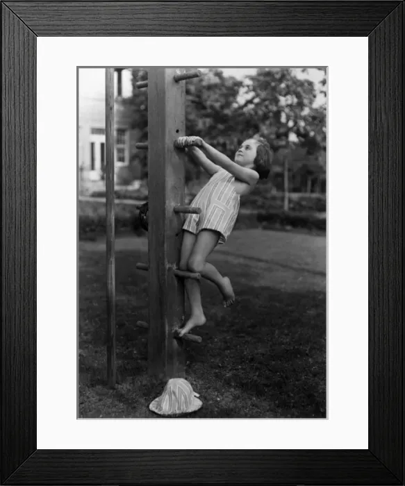 Framed Print : Girl on Climbing Frame Framed Print : Girl on Climbing Frame