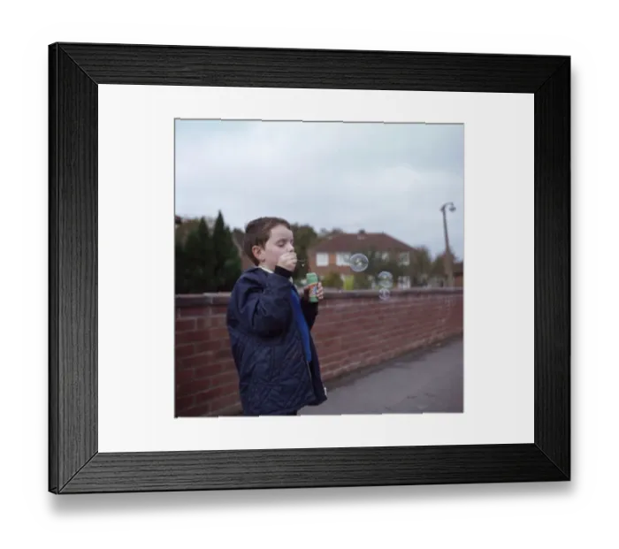 Framed Print : Boy Blowing Bubbles Framed Print : Boy Blowing Bubbles
