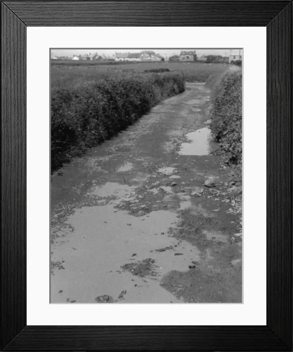 Framed Print : Potholes in a Road Framed Print : Potholes in a Road