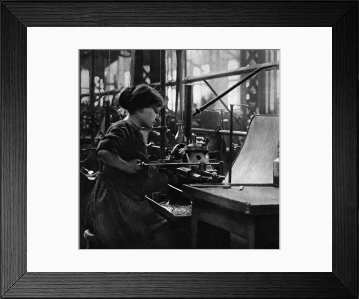 Framed Print : French woman in a munitions factory, making parts for arti Framed Print : French woman in a munitions factory, making parts for arti