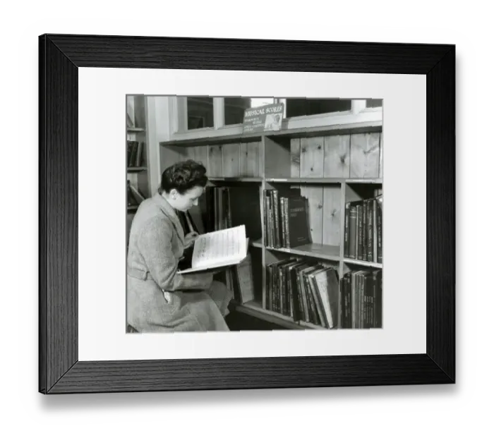Framed Print : Reading a score in a music library Framed Print : Reading a score in a music library