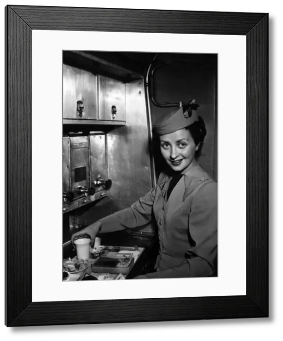 Framed Print : TWA air stewardess prepares a meal Framed Print : TWA air stewardess prepares a meal
