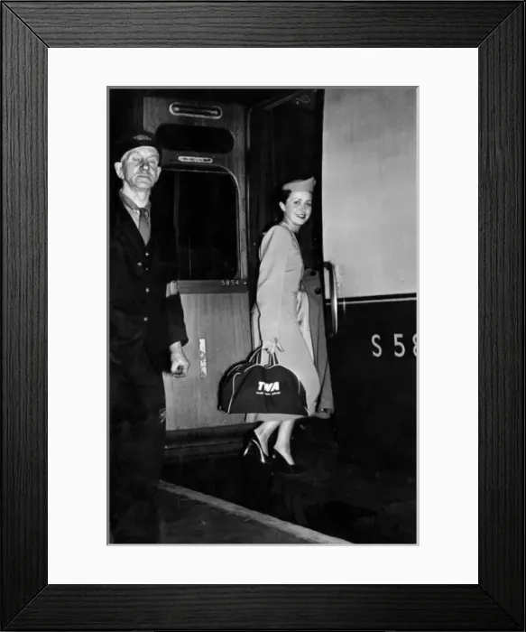Framed Print : TWA air stewardess boarding a train Framed Print : TWA air stewardess boarding a train