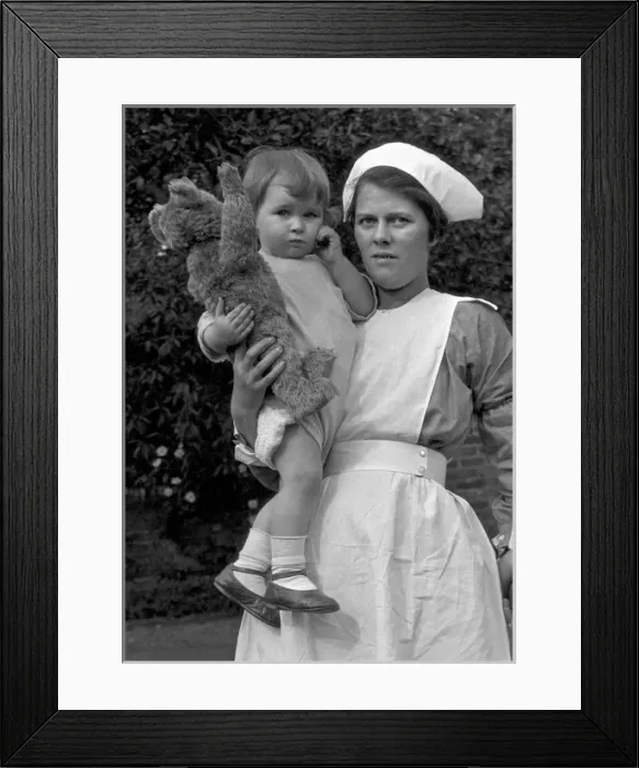 Framed Print : Nurse with toddler and teddy bear Framed Print : Nurse with toddler and teddy bear