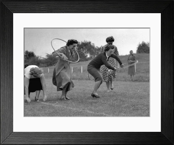 Framed Print : Women running a race with hoops Framed Print : Women running a race with hoops