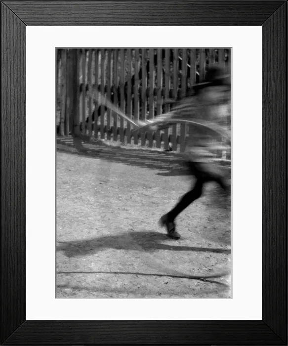 Framed Print : Blurred image of child with hoop and stick Framed Print : Blurred image of child with hoop and stick