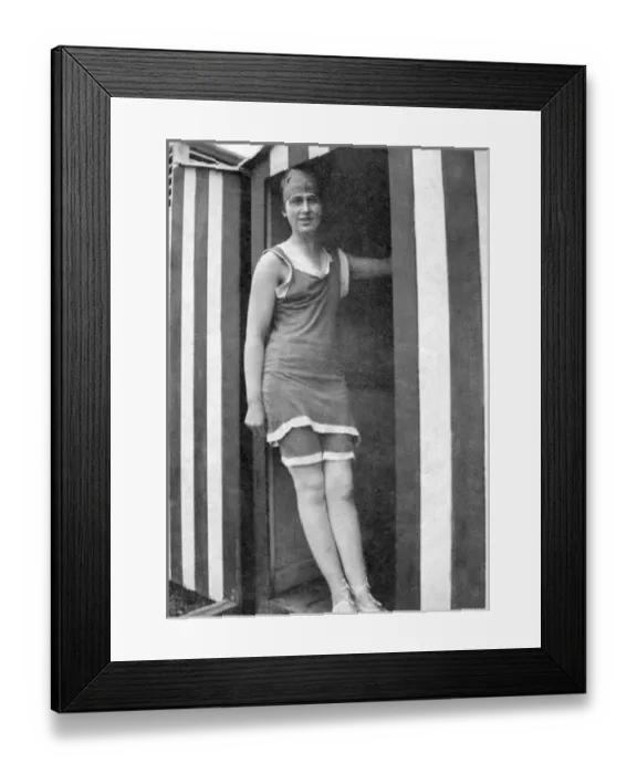 Framed Print : Woman standing in beach hut doorway Framed Print : Woman standing in beach hut doorway