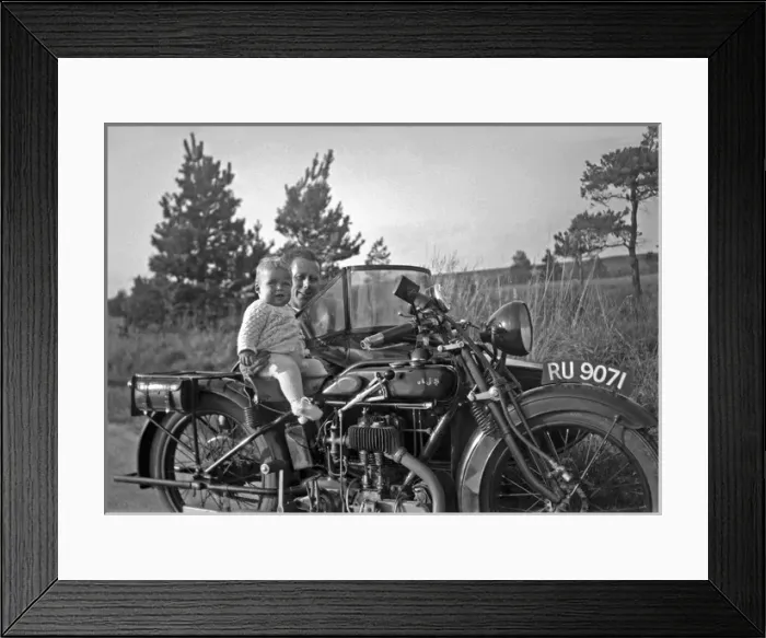 Framed Print : Man with motorbike and baby Framed Print : Man with motorbike and baby
