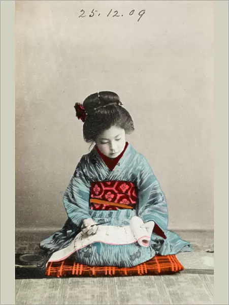 Japanese girl practising calligraphy