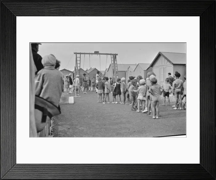 Framed Print : Children queueing up for a ride on the swings Framed Print : Children queueing up for a ride on the swings