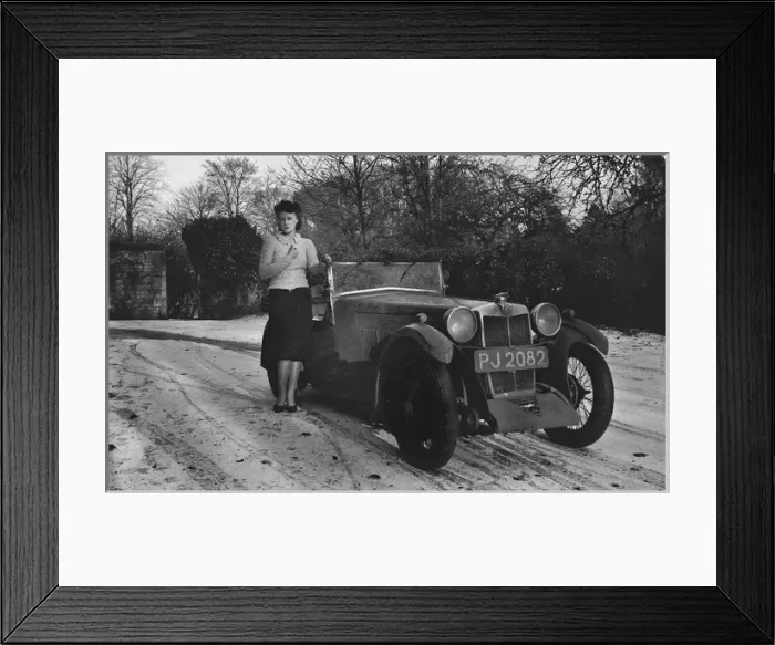Framed Print : Woman standing by car in snowy weather Framed Print : Woman standing by car in snowy weather
