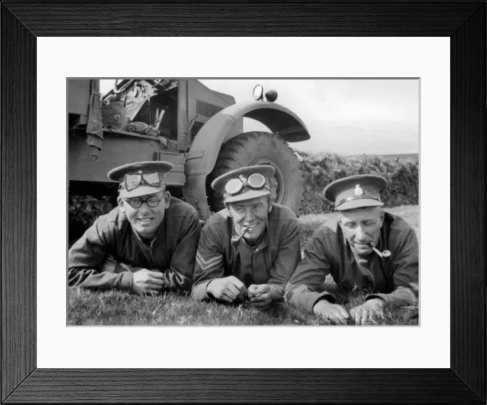 Framed Print : Three soldiers lying on the grass by their jeep Framed Print : Three soldiers lying on the grass by their jeep