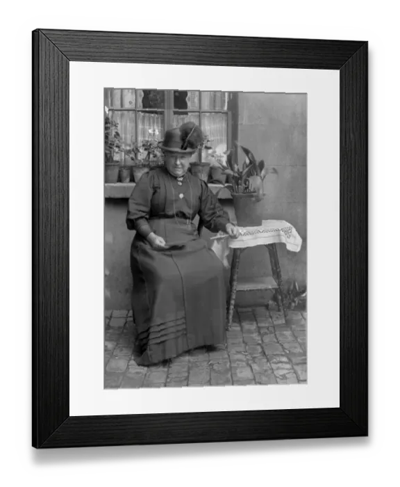 Framed Print : Middle-aged woman with potted plants
