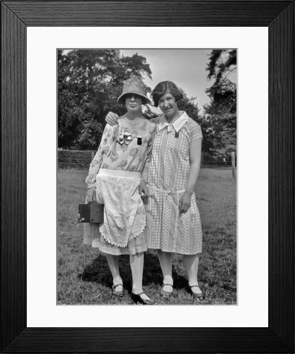 Framed Print : Two women posing in a field Framed Print : Two women posing in a field