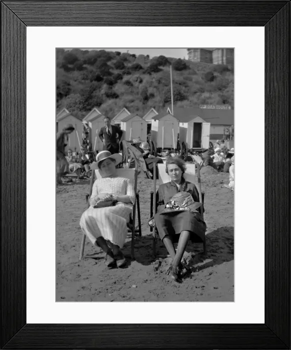 Framed Print : Two women sitting on a beach Framed Print : Two women sitting on a beach
