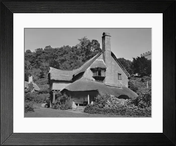 Framed Print : A picturesque house with a thatched roof Framed Print : A picturesque house with a thatched roof