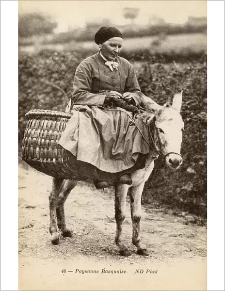 Basque woman riding a donkey