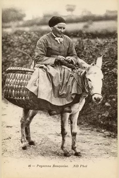 Basque woman riding a donkey