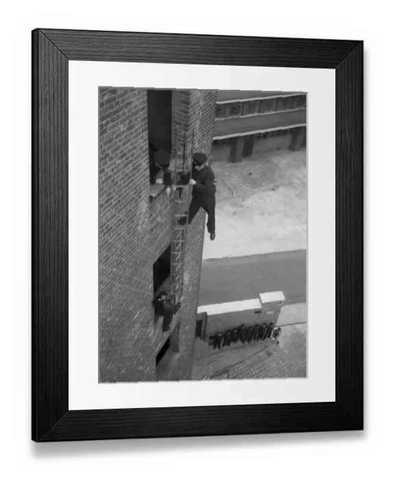 Framed Print : Firefighter during hook ladder practice Framed Print : Firefighter during hook ladder practice