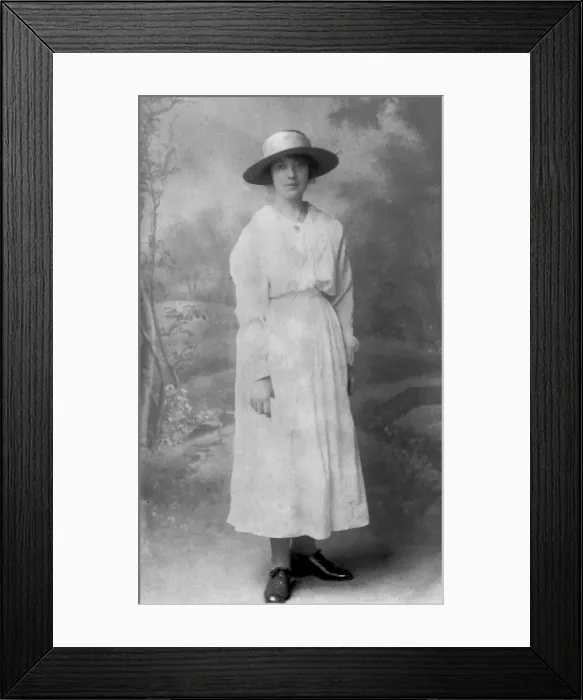 Framed Print : Elegant woman in long white dress and wide-brimmed hat Framed Print : Elegant woman in long white dress and wide-brimmed hat