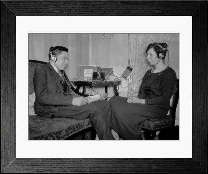 Framed Print : Man and woman with radio equipment Framed Print : Man and woman with radio equipment