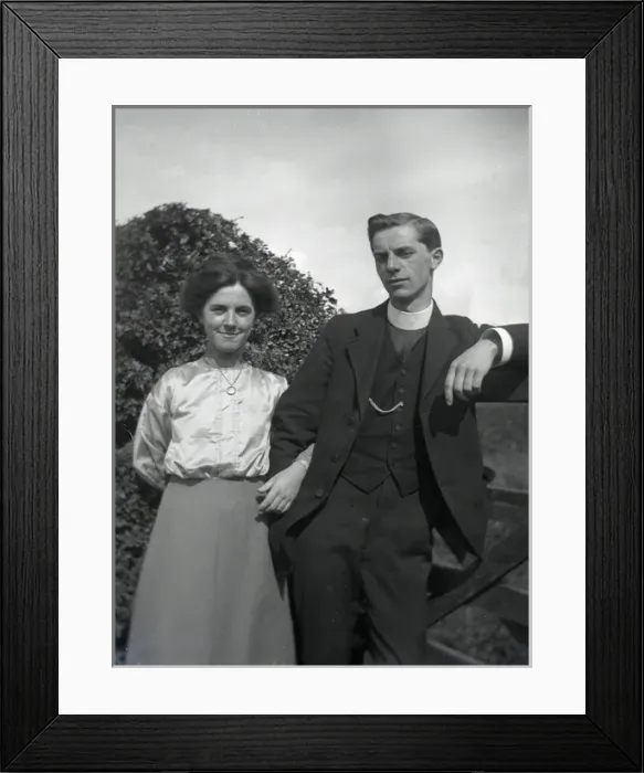 Framed Print : Young clergyman with young woman Framed Print : Young clergyman with young woman