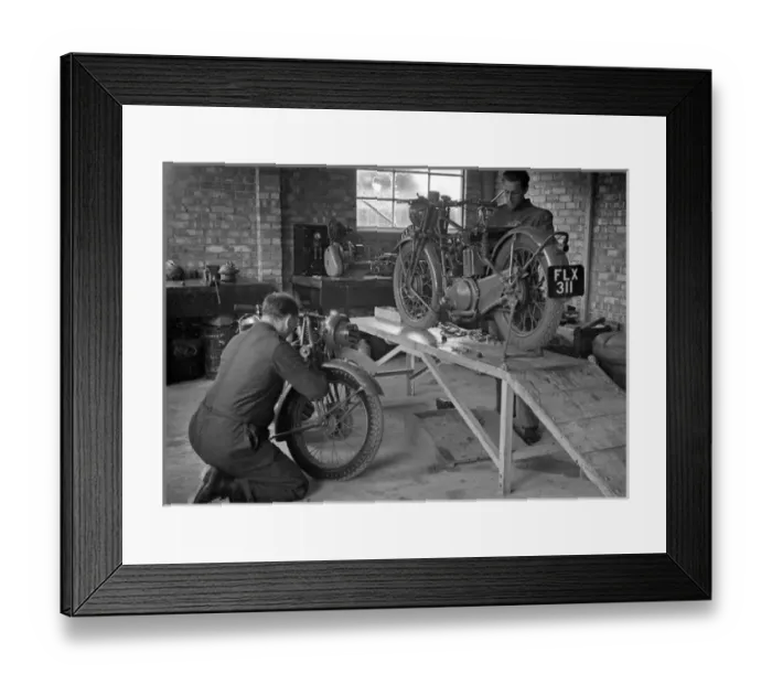 Framed Print : Two men repairing motorcycles Framed Print : Two men repairing motorcycles