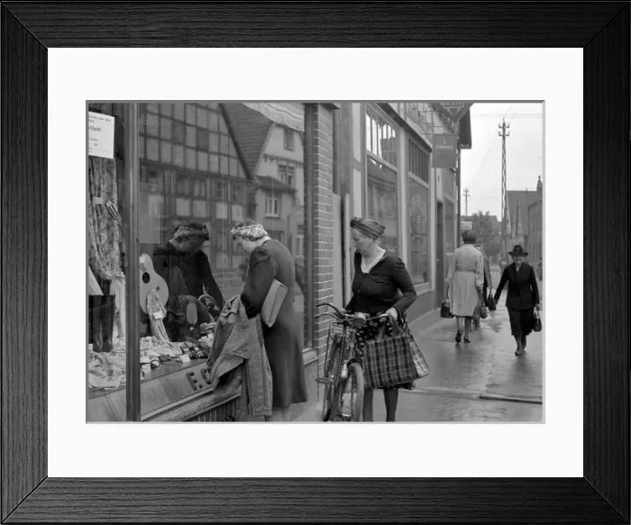 Framed Print : Women looking in a shop window Framed Print : Women looking in a shop window