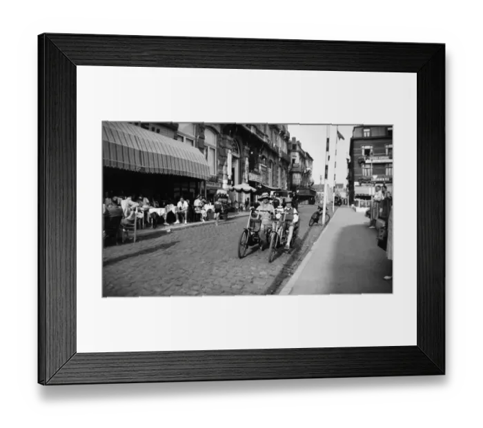Framed Print : Woman and boy on two-seater cycle, Bruges, Belgium Framed Print : Woman and boy on two-seater cycle, Bruges, Belgium