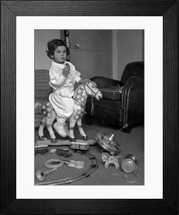 Framed Print : Little boy playing with his toys Framed Print : Little boy playing with his toys