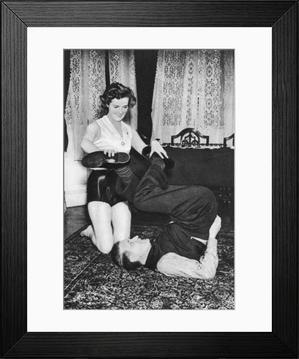 Framed Print : Prunella Stack maniuplating Herbert Barkers legs, 1939 Framed Print : Prunella Stack maniuplating Herbert Barkers legs, 1939