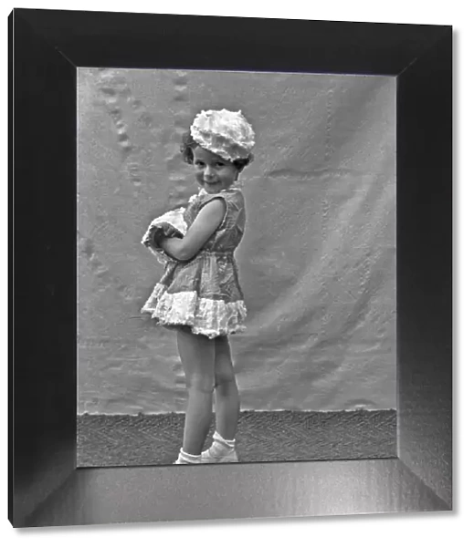 Little girl posing in a short dress