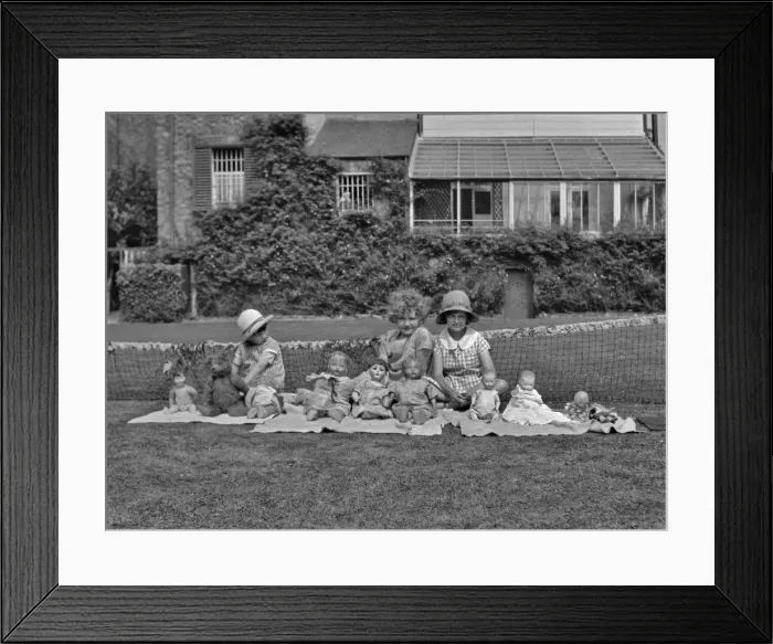 Framed Print : Three girls in a garden with dolls Framed Print : Three girls in a garden with dolls