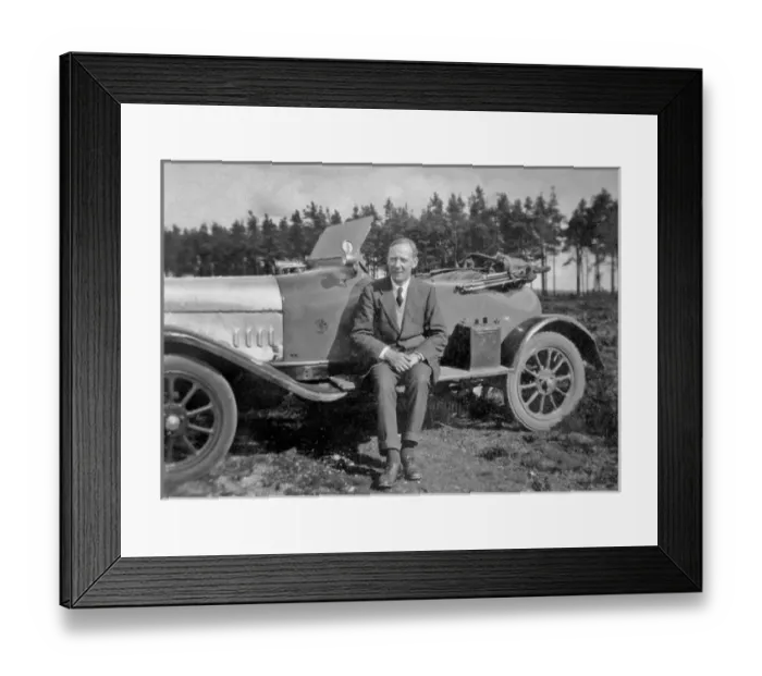 Framed Print : Man sitting on running board of sports car Framed Print : Man sitting on running board of sports car