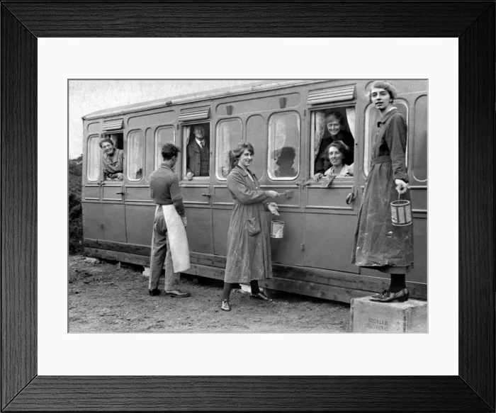 Framed Print : Holidaymakers painting a railway carriage Framed Print : Holidaymakers painting a railway carriage