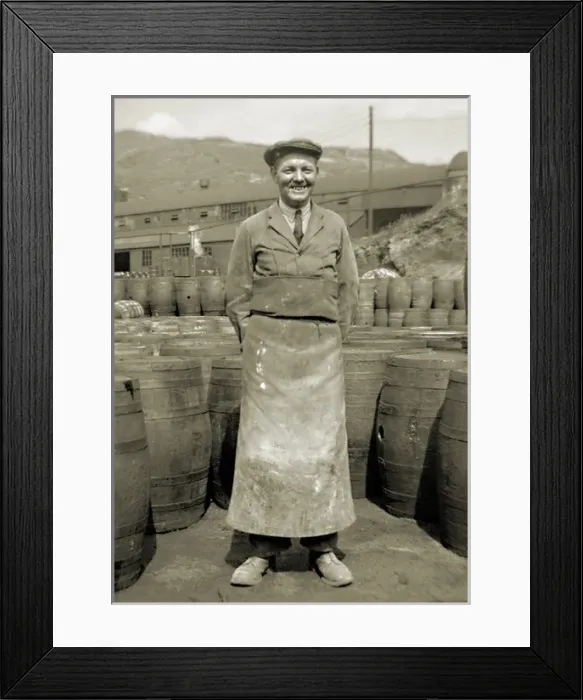 Framed Print : Workman in apron with barrels Framed Print : Workman in apron with barrels