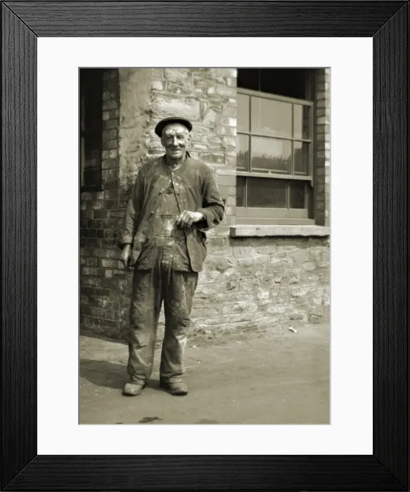 Framed Print : Workman standing outside a building Framed Print : Workman standing outside a building