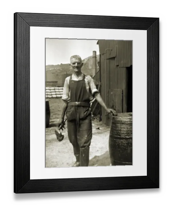 Framed Print : Workman in overalls with barrel Framed Print : Workman in overalls with barrel