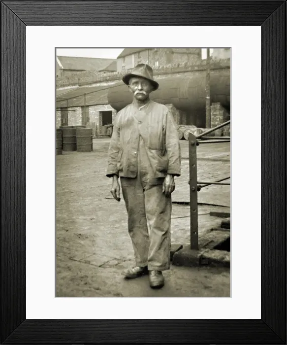 Framed Print : Elderly workman in a yard Framed Print : Elderly workman in a yard