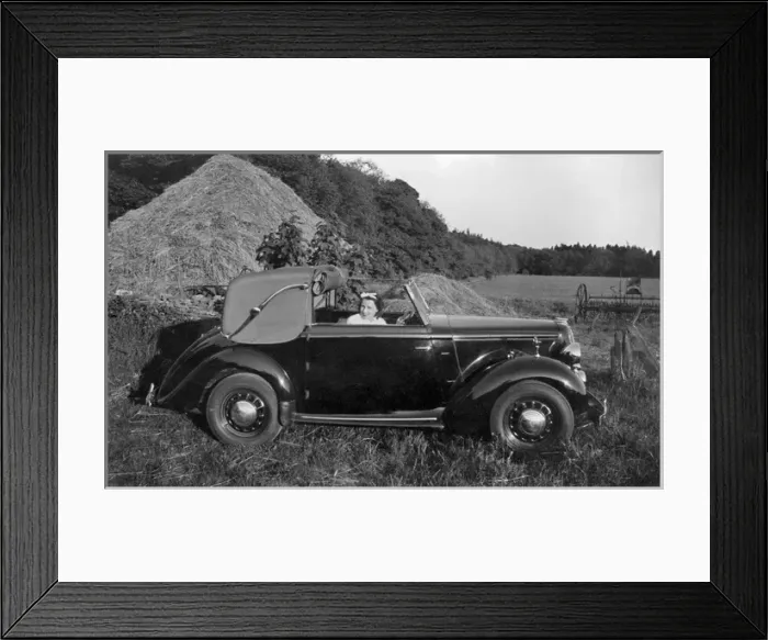 Framed Print : Woman in a car near a haystack Framed Print : Woman in a car near a haystack