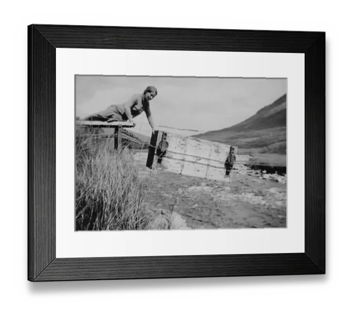 Framed Print : Woman pushing box ferry across river Framed Print : Woman pushing box ferry across river