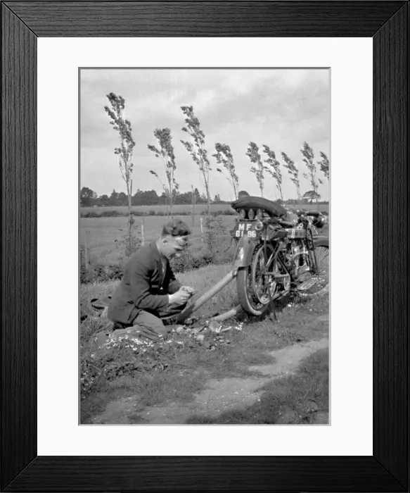 Framed Print : Man with motorbike in a field Framed Print : Man with motorbike in a field