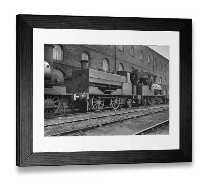 Framed Print : Steam engine at side of building Framed Print : Steam engine at side of building