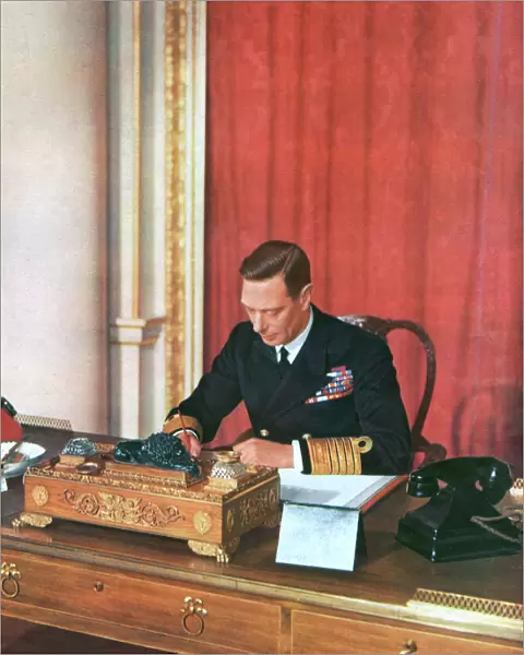 King George VI at his desk in naval uniform, 1942